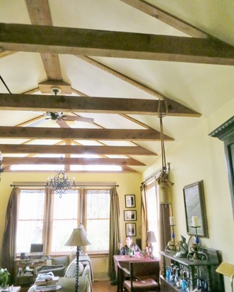 Picture of big sunny room with gabled ceiling.