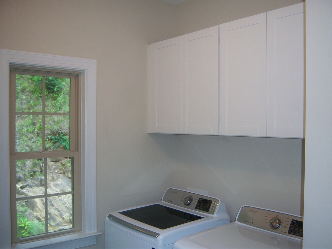 Laundry room cabinets with shelves