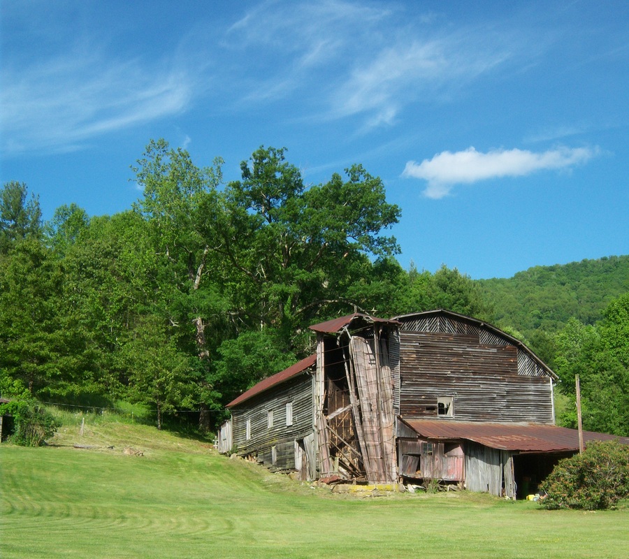 Historic barn in upper Big Pine with collapsed wooden silo tower