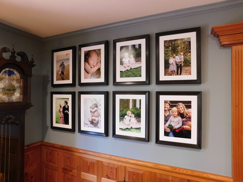 Hanging a gallery wall in Asheville, NC with square pictures evenly spaced apart