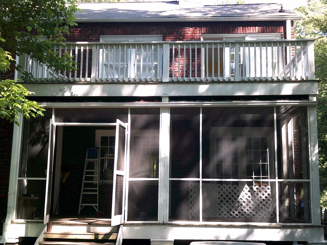 Picture of a screen-in porch from the street, before repainting.