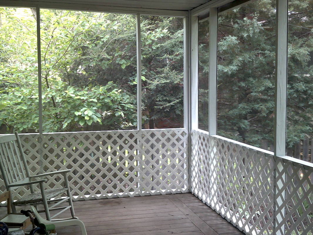 Picture of a screened in porch from inside