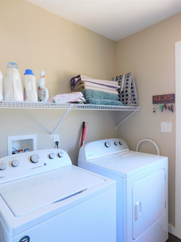 Laundry closet with new wire shelving installed
