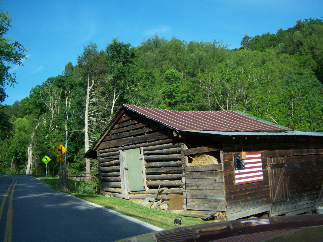 Log Barn by the side of the raod