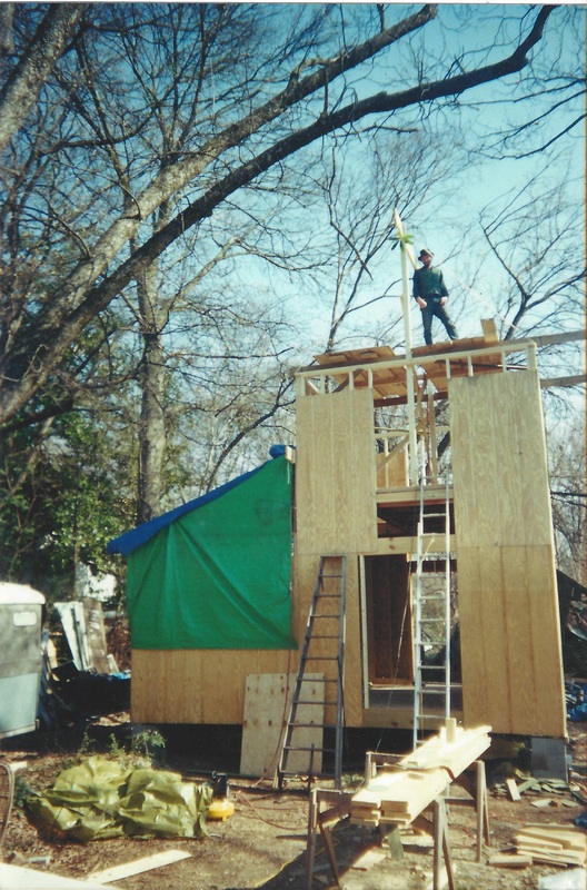 handyman working on tiny house