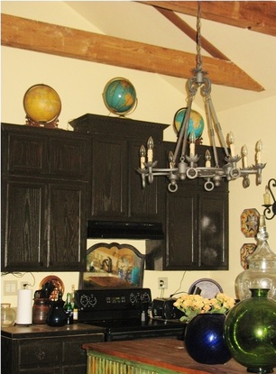 Picture of kitchen with dark cabinets.