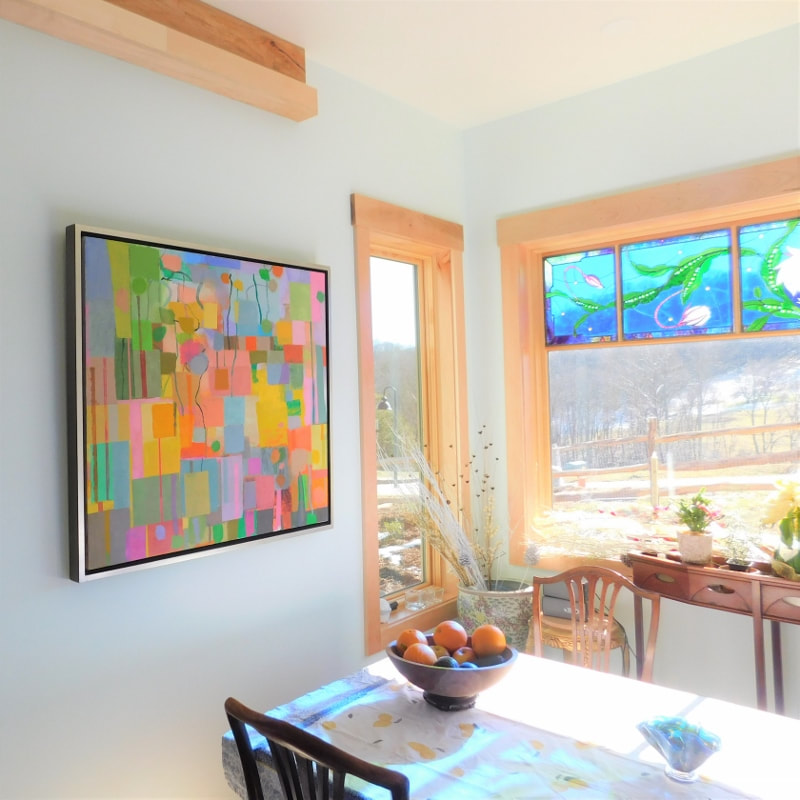 Hanging an original oil painting in a kitchen in Asheville, NC